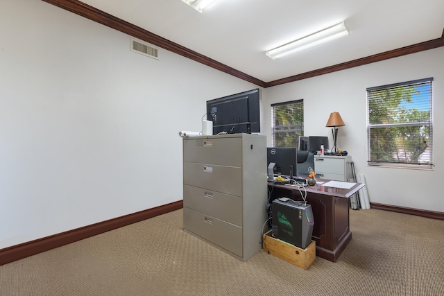 home office featuring visible vents, light colored carpet, baseboards, and ornamental molding