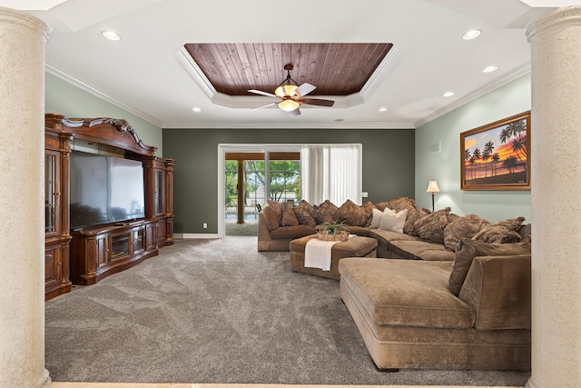 carpeted living area featuring a ceiling fan, a tray ceiling, decorative columns, recessed lighting, and crown molding