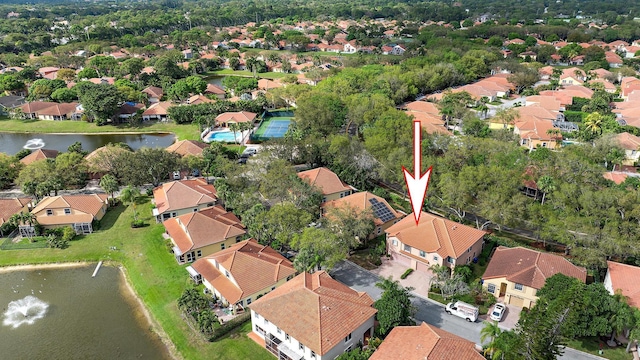 drone / aerial view with a water view and a residential view