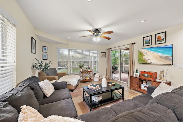 living room with a ceiling fan, recessed lighting, and light wood finished floors