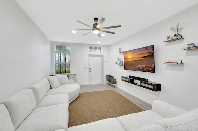 living area featuring ceiling fan, baseboards, wood finished floors, and recessed lighting