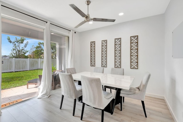 dining space featuring light wood-type flooring, ceiling fan, baseboards, and recessed lighting