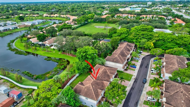 bird's eye view featuring a water view and a residential view