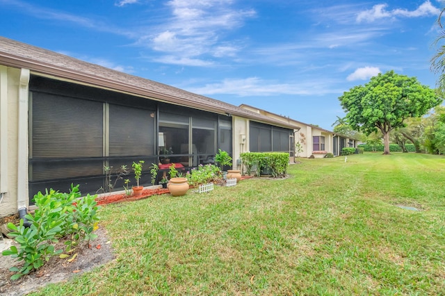 view of yard with a sunroom