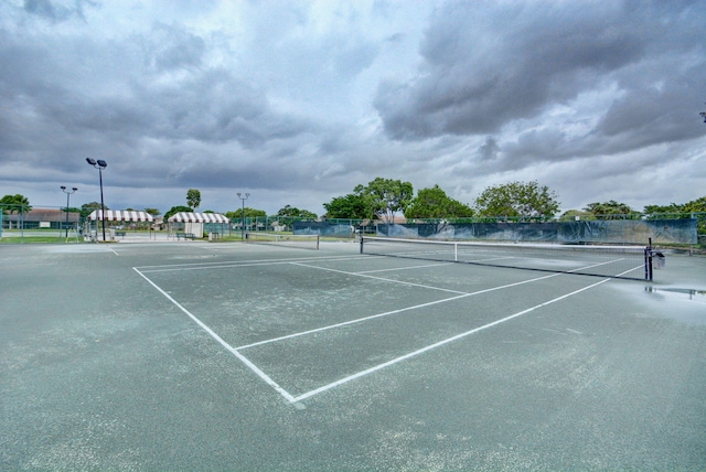 view of sport court featuring fence