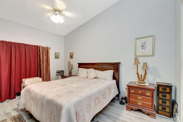 bedroom featuring vaulted ceiling and wood finished floors