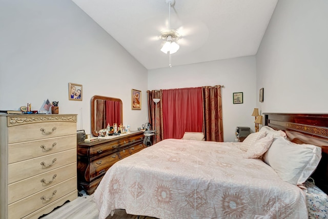 bedroom with a ceiling fan and lofted ceiling