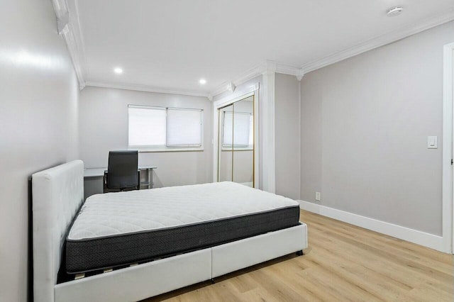 bedroom featuring recessed lighting, crown molding, baseboards, and wood finished floors