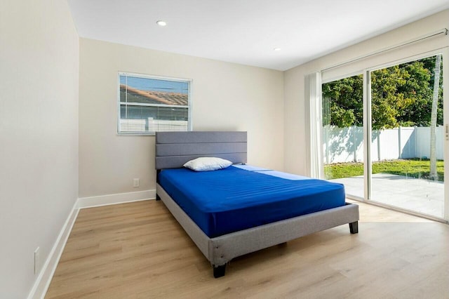 bedroom with access to outside, baseboards, light wood-style flooring, and recessed lighting