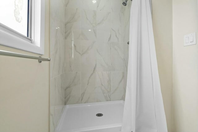 bathroom with a shower stall