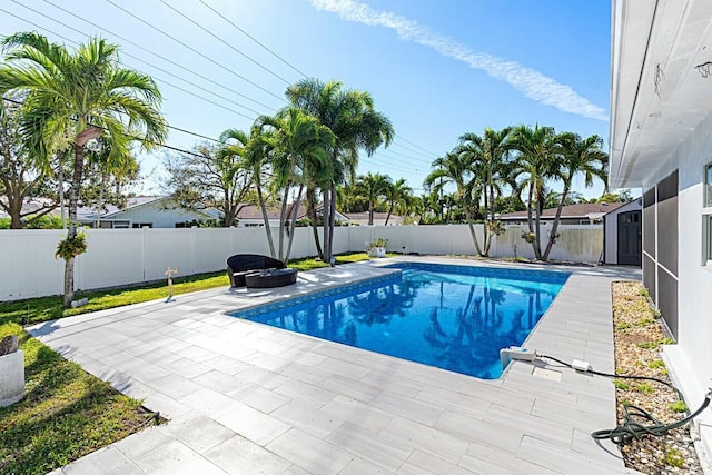 view of pool with a fenced backyard, a fenced in pool, and a patio