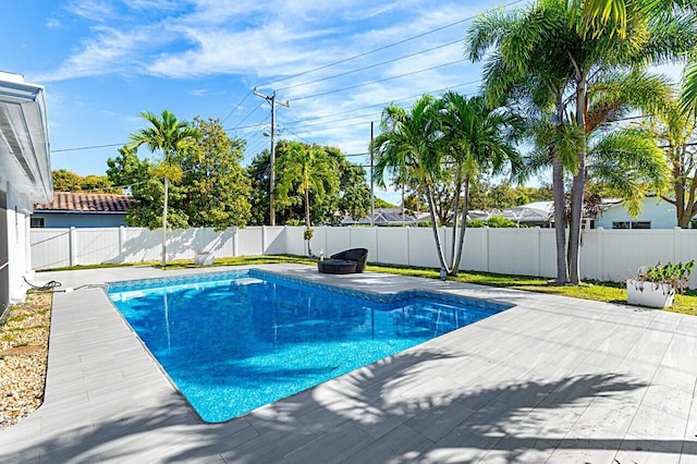 view of pool featuring a patio area, a fenced backyard, and a fenced in pool