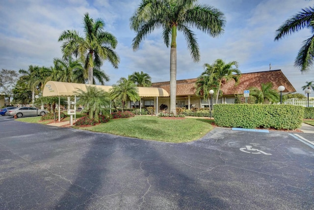 view of property featuring uncovered parking