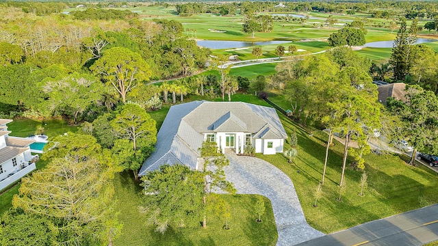 birds eye view of property featuring a water view and golf course view