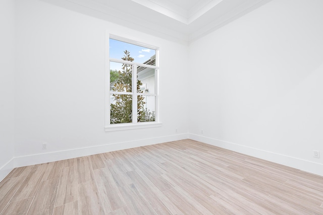 unfurnished room featuring light wood-type flooring and baseboards