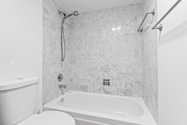bathroom featuring toilet and washtub / shower combination