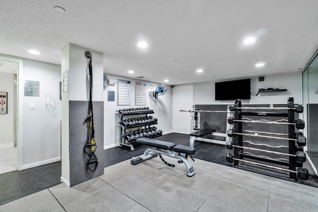 exercise area with recessed lighting, visible vents, baseboards, and a textured ceiling