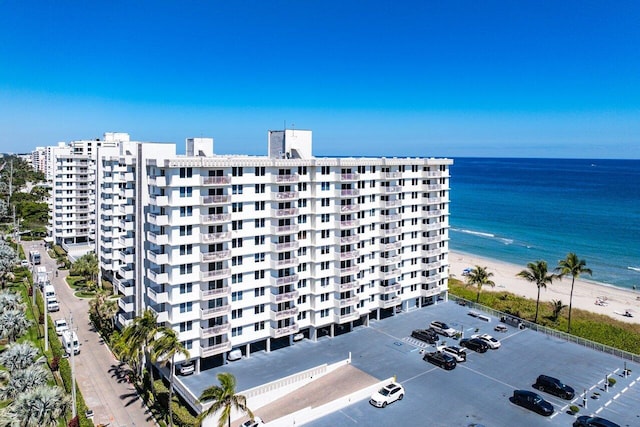 exterior space featuring a view of the beach and a water view