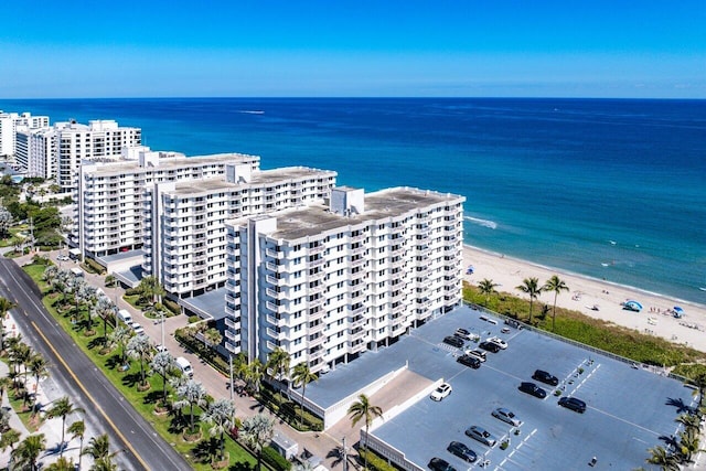 birds eye view of property featuring a city view and a water view