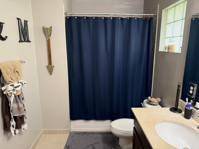 bathroom with tile patterned flooring, vanity, toilet, and baseboards