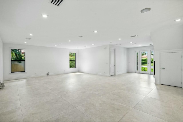 spare room with recessed lighting, baseboards, visible vents, and light tile patterned floors