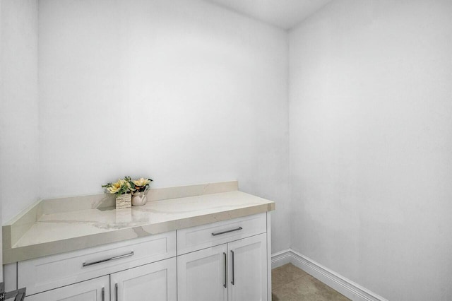 bathroom featuring tile patterned floors and baseboards