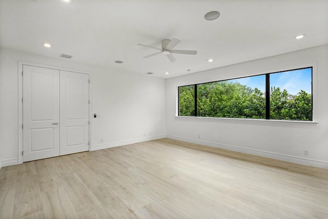 unfurnished room with visible vents, recessed lighting, baseboards, and light wood-style floors