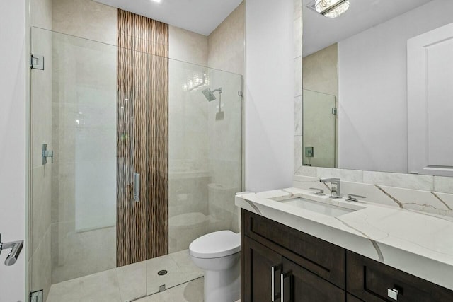 full bathroom with vanity, tile patterned floors, toilet, and a stall shower