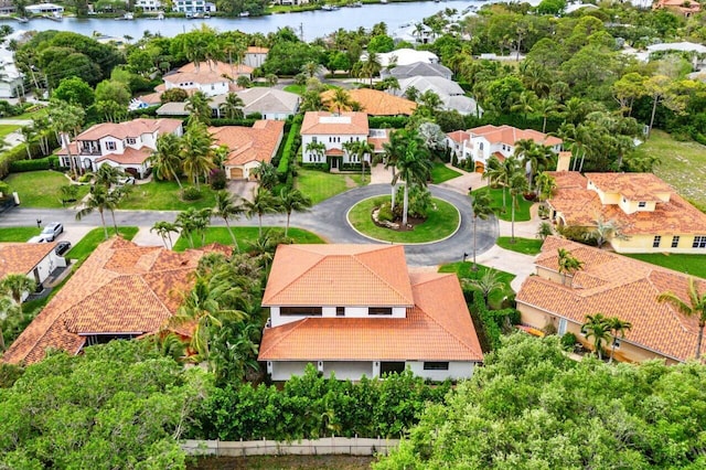 aerial view with a residential view and a water view