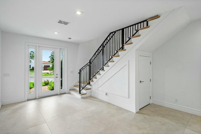 foyer entrance featuring recessed lighting, visible vents, baseboards, and stairs