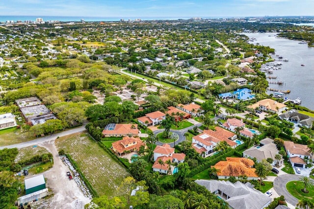 aerial view featuring a water view and a residential view