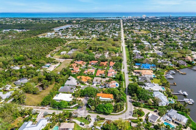 birds eye view of property featuring a residential view and a water view