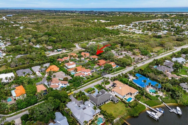 bird's eye view featuring a residential view and a water view