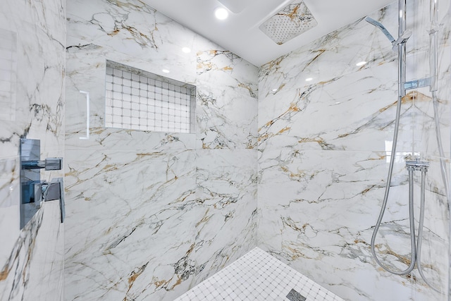 full bathroom with a marble finish shower