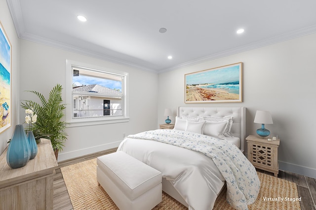 bedroom featuring recessed lighting, crown molding, baseboards, and wood finished floors