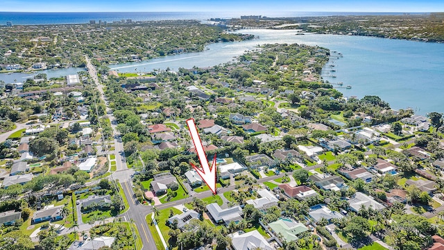 bird's eye view featuring a water view and a residential view