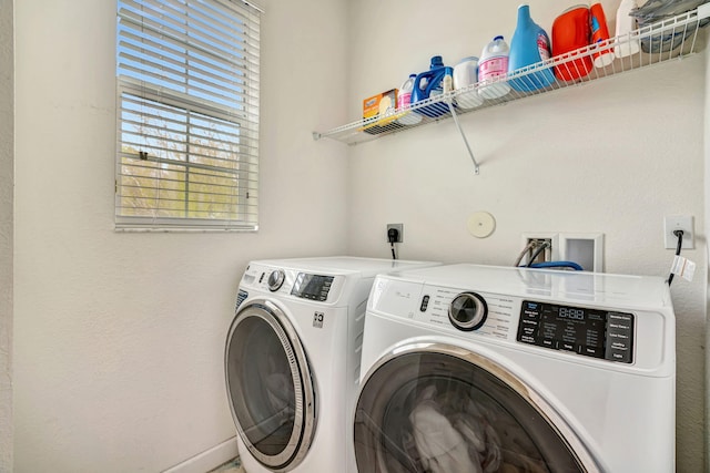 laundry room featuring laundry area and washer and clothes dryer