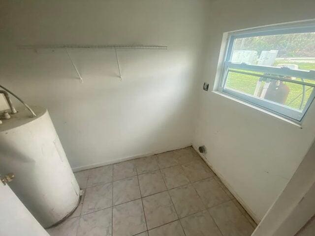 washroom featuring light tile patterned flooring