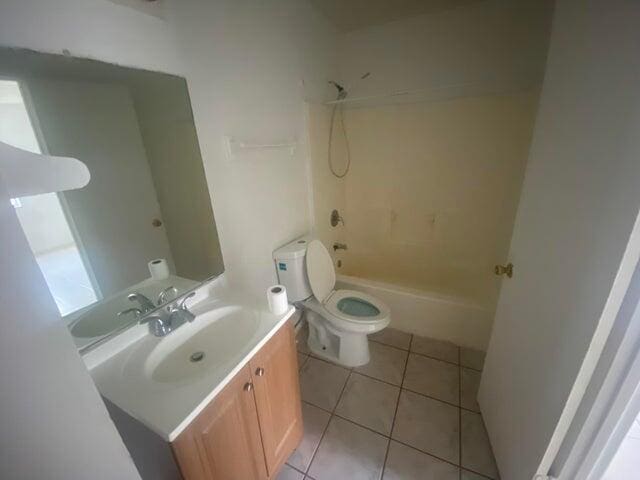 full bath with toilet, shower / bathtub combination, vanity, and tile patterned floors