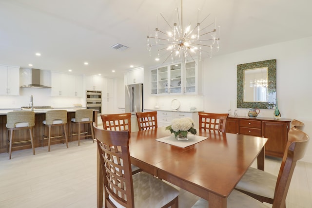 8579 SE Sabal St, Hobe Sound, FL 33455 - dining area with a chandelier and recessed lighting