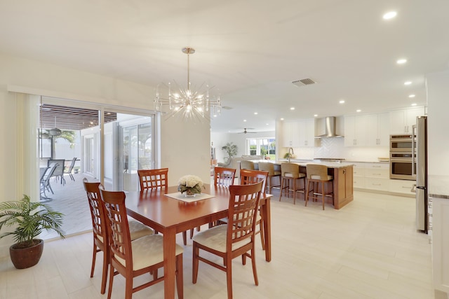 8579 SE Sabal St, Hobe Sound, FL 33455 - dining room with recessed lighting and a chandelier