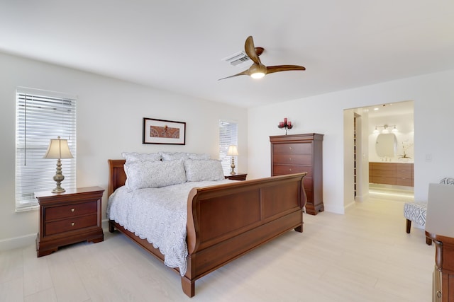 8579 SE Sabal St, Hobe Sound, FL 33455 - bedroom featuring baseboards, a ceiling fan, and connected bathroom