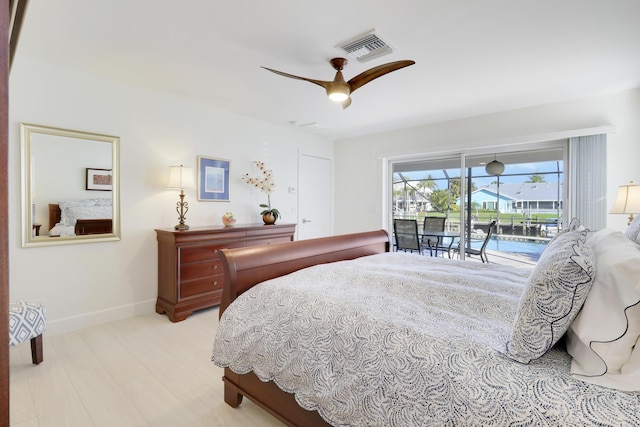 8579 SE Sabal St, Hobe Sound, FL 33455 - bedroom with access to exterior, baseboards, and a ceiling fan
