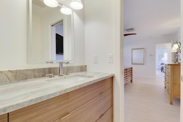 8579 SE Sabal St, Hobe Sound, FL 33455 - bathroom featuring vanity and wood finished floors
