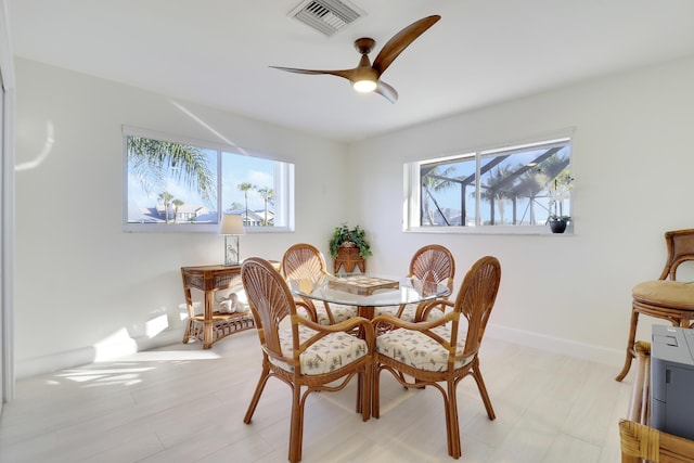 8579 SE Sabal St, Hobe Sound, FL 33455 - dining space featuring plenty of natural light, ceiling fan, and baseboards