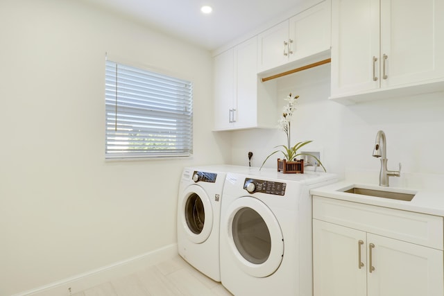 8579 SE Sabal St, Hobe Sound, FL 33455 - laundry area with washer and dryer, baseboards, cabinet space, recessed lighting, and light tile patterned flooring