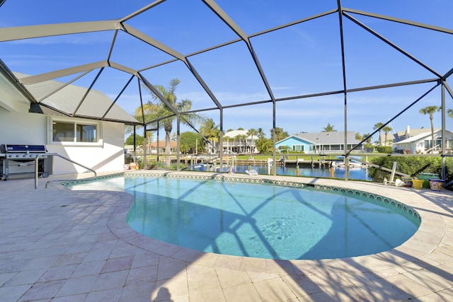 8579 SE Sabal St, Hobe Sound, FL 33455 - swimming pool with area for grilling, a patio, a residential view, a water view, and glass enclosure