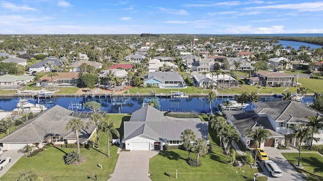 8579 SE Sabal St, Hobe Sound, FL 33455 - aerial view of residential area with a nearby body of water