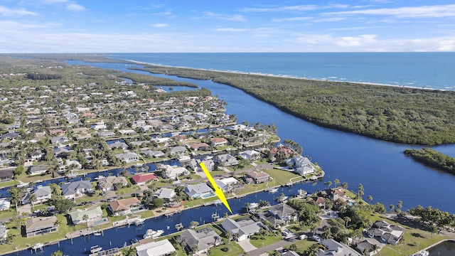8579 SE Sabal St, Hobe Sound, FL 33455 - aerial overview of property's location with a nearby body of water and nearby suburban area