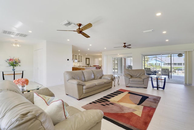 8579 SE Sabal St, Hobe Sound, FL 33455 - living room featuring ceiling fan, recessed lighting, light wood-type flooring, and a chandelier